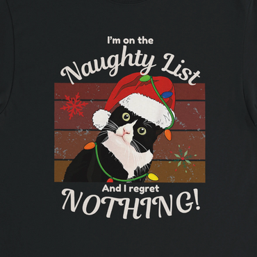 Black t-shirt with a cat wearing a Santa hat and Christmas lights, text 'I'm on the Naughty List And I regret NOTHING!' on a dark background.
